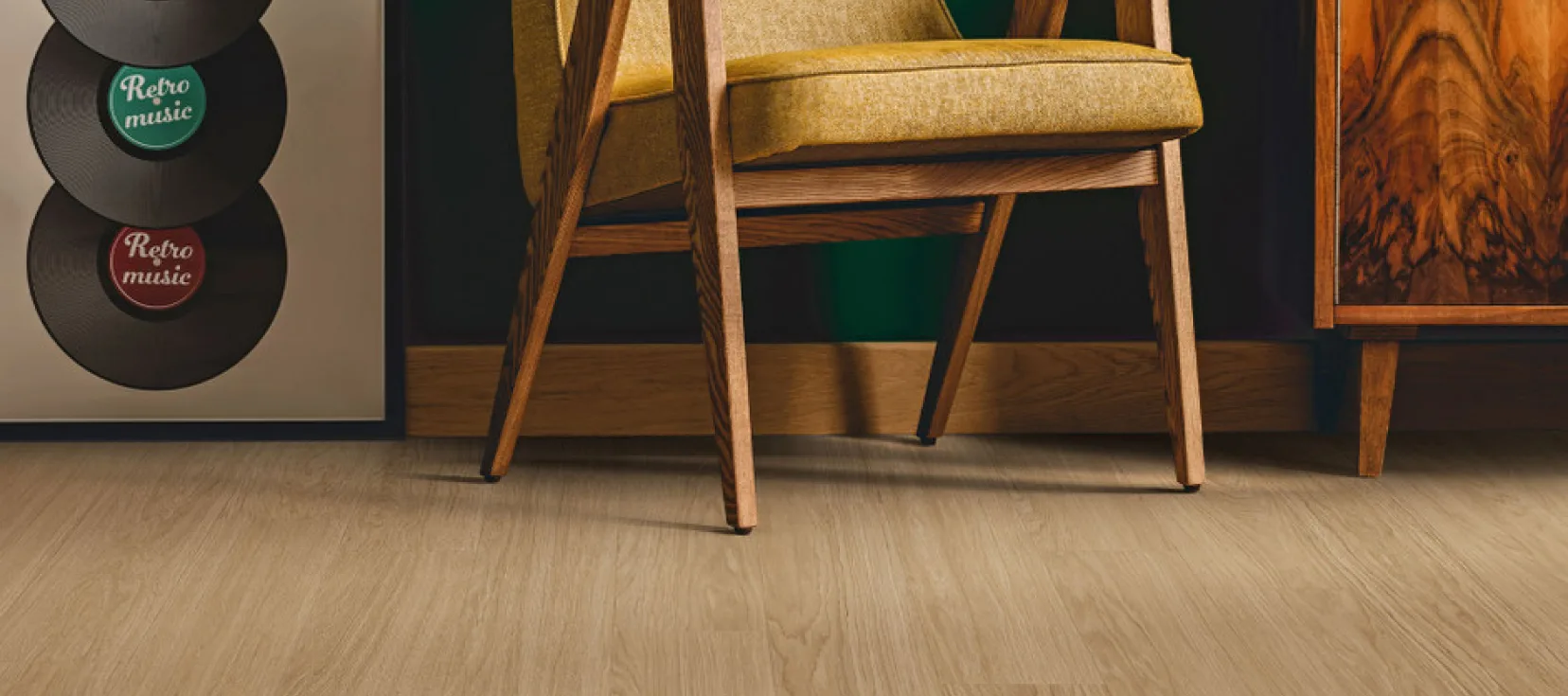 A sophisticated interior featuring Engineered Floors Hard Surface in a light wood finish. A vintage-style yellow chair and a wooden cabinet sit alongside a retro music-themed decor piece.