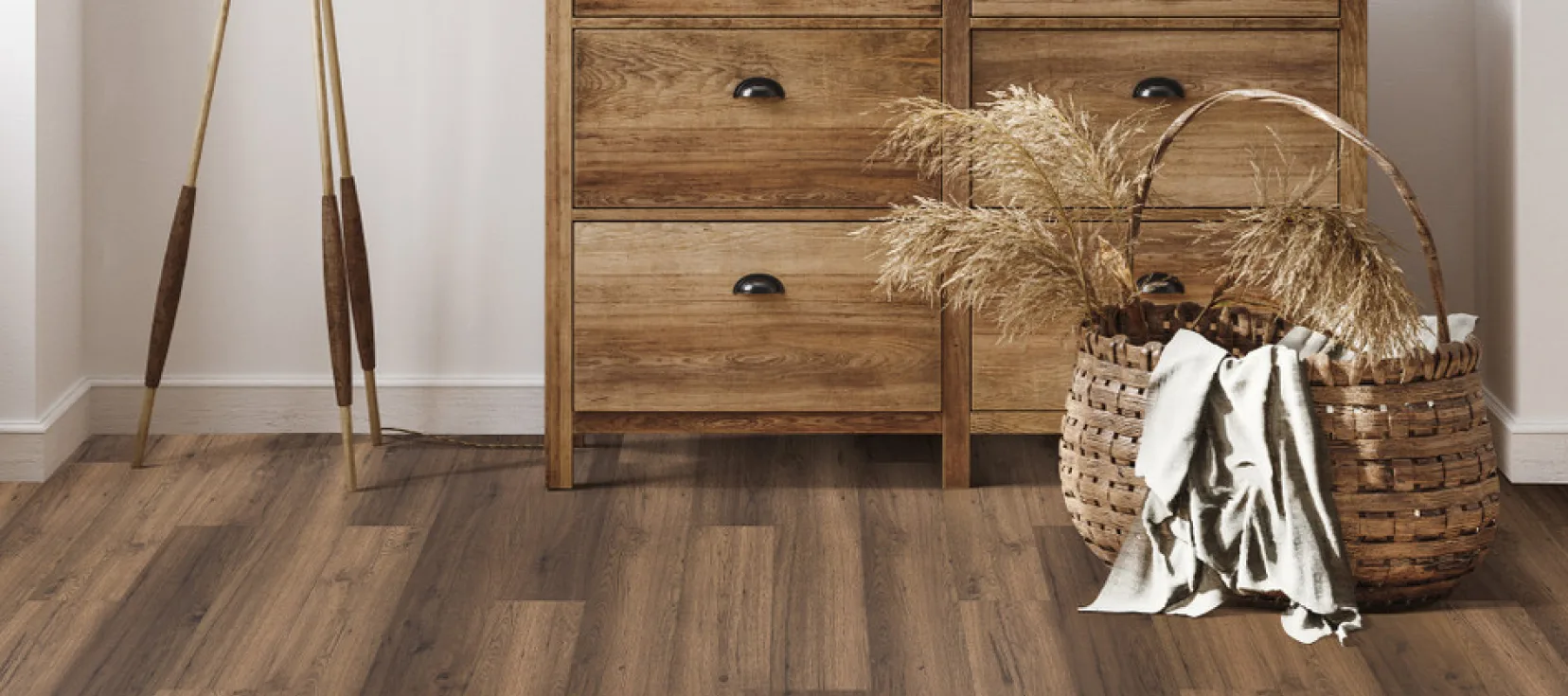A cozy room with natural wooden flooring and rustic wooden furniture.