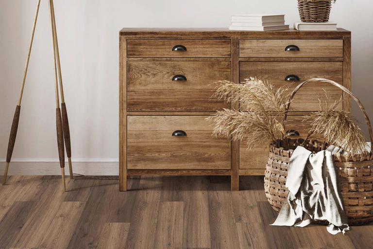 A chest, lamp, and basket on EF hard surface flooring
